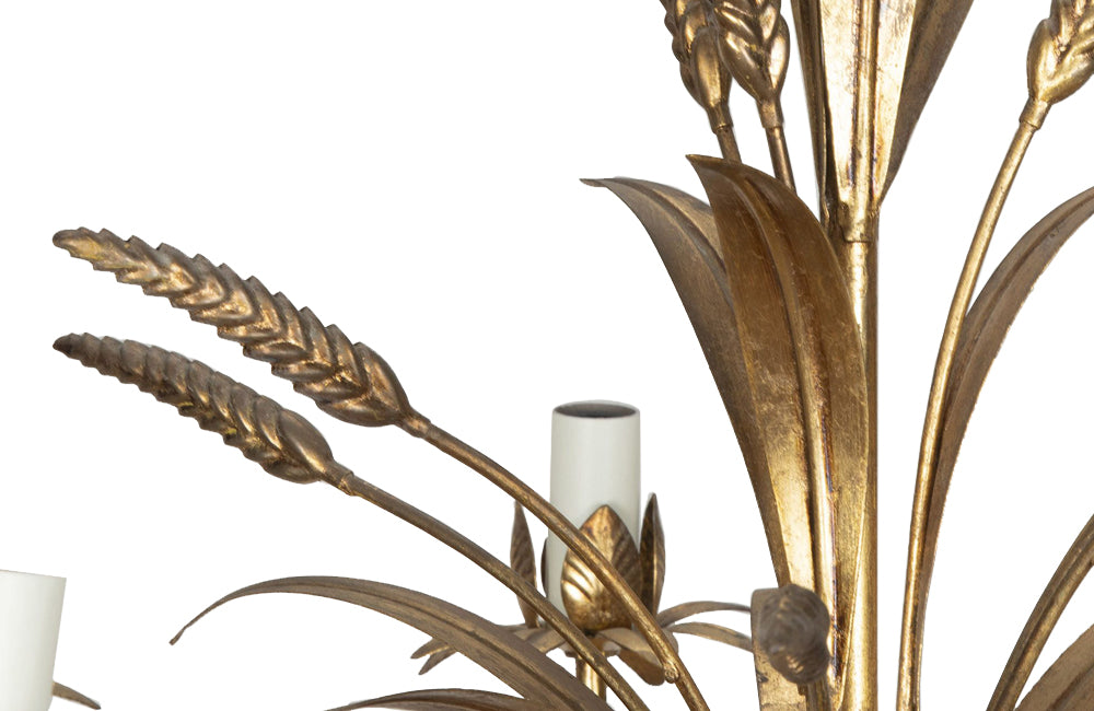 Large Mid-Century French, Hollywood Regency style, gilt tole wheat sheaf chandelier with eight curved leaved branches bulb holders