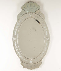 An elegant large Mid-Century Italian Venetian style oval mirror.