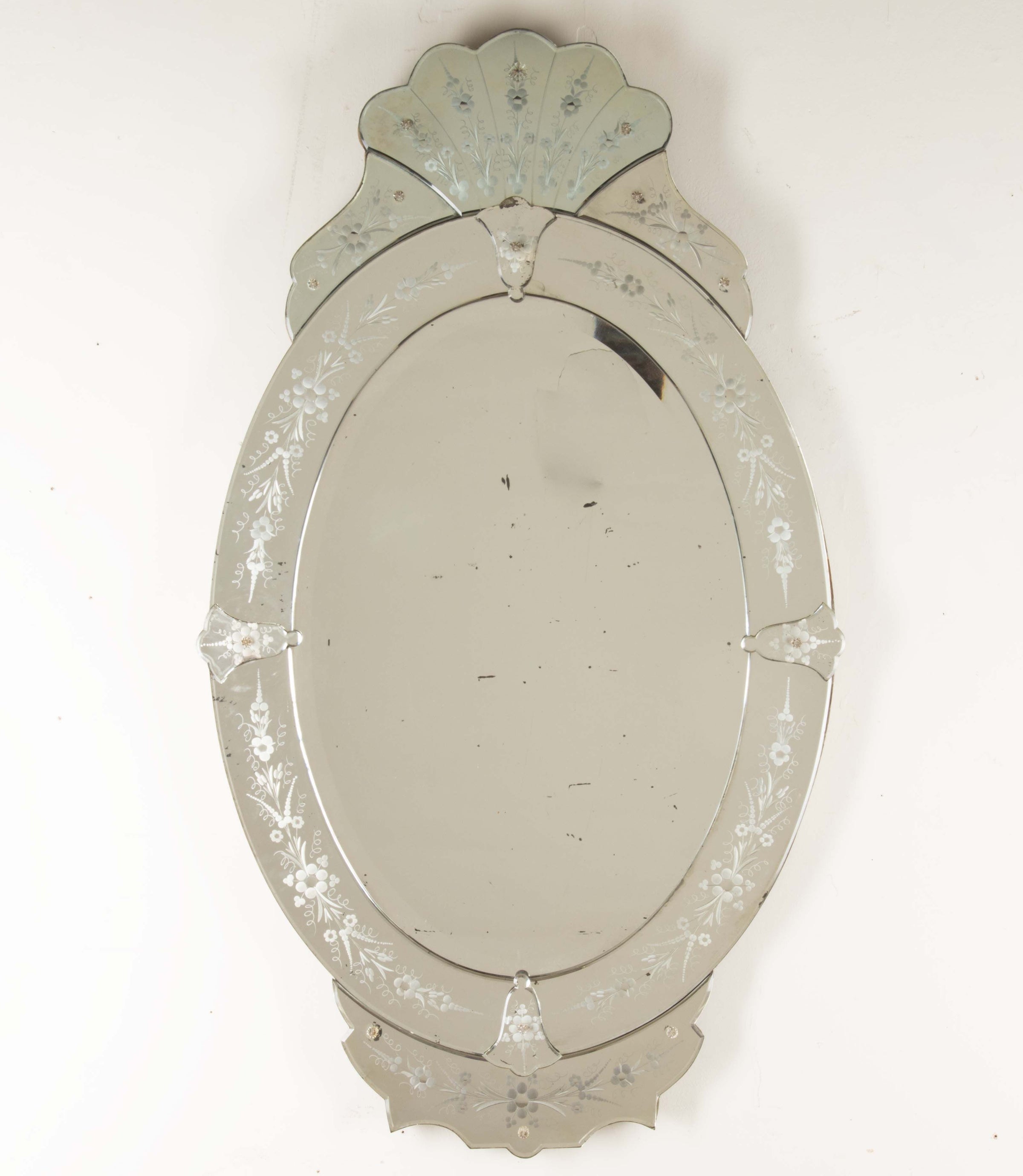 An elegant large Mid-Century Italian Venetian style oval mirror.