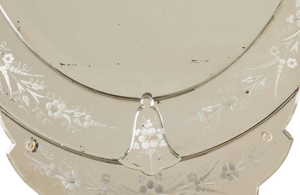 An elegant large Mid-Century Italian Venetian style oval mirror.