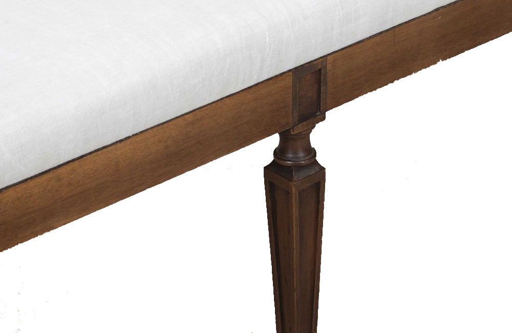 Large early 20th Century French walnut banquette in the Neo-Classical style.