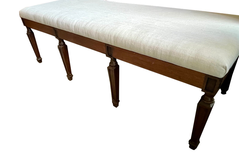 Large early 20th Century French walnut banquette in the Neo-Classical style.