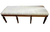 Large early 20th Century French walnut banquette in the Neo-Classical style.