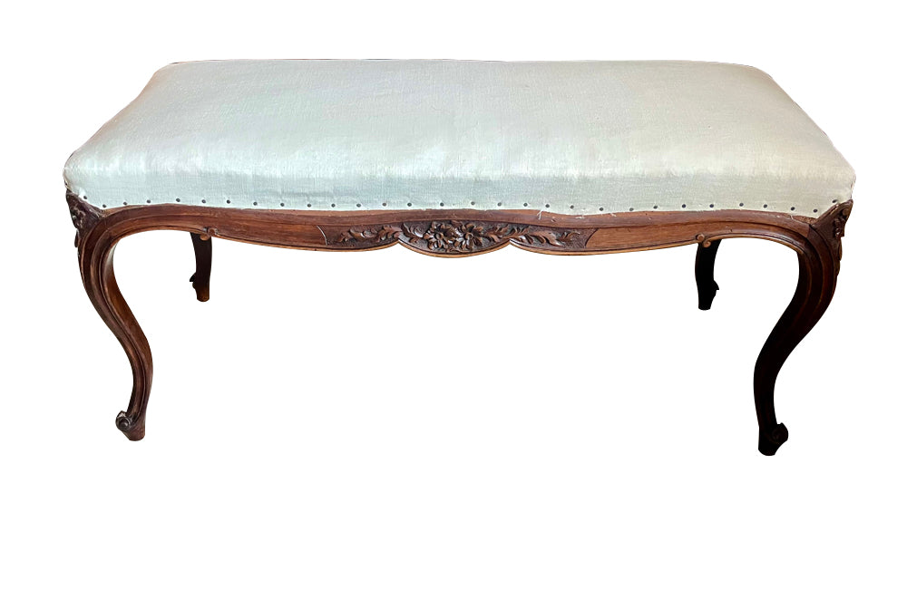 Antique bench or banquette 19th Century French walnut in the Louis XV style. French antique furniture.