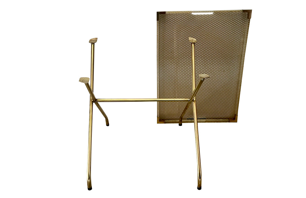 Large lucite tray with brass corners and embedded mesh with two incorporated handles sitting on a separate brass stand.