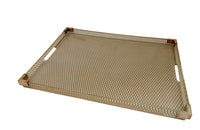 Large lucite tray with brass corners and embedded mesh with two incorporated handles sitting on a separate brass stand.