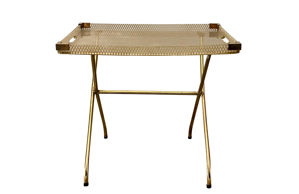 Large lucite tray with brass corners and embedded mesh with two incorporated handles sitting on a separate brass stand.