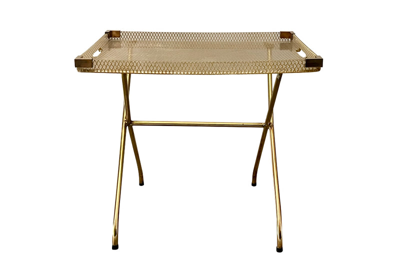 Large lucite tray with brass corners and embedded mesh with two incorporated handles sitting on a separate brass stand.