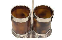 Stylish Mid-Century Italian double bottle holder in faux tortoiseshell lucite and silver plate mounts.