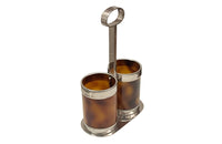 Stylish Mid-Century Italian double bottle holder in faux tortoiseshell lucite and silver plate mounts.
