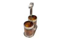 Stylish Mid-Century Italian double bottle holder in faux tortoiseshell lucite and silver plate mounts.
