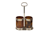 Stylish Mid-Century Italian double bottle holder in faux tortoiseshell lucite and silver plate mounts.