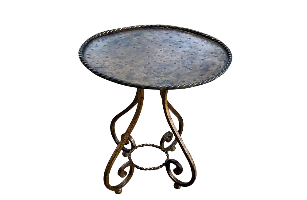 Mid-Century Cocktail Table, iron, Spanish. Featuring a hand-hammered circular metal top with a rope twist rim.