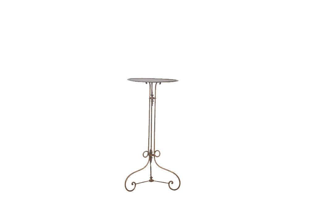 French late 19th century ron gueridon with gilt iron base that bears three decorative finials, to the top, middle and base of the tripod support.