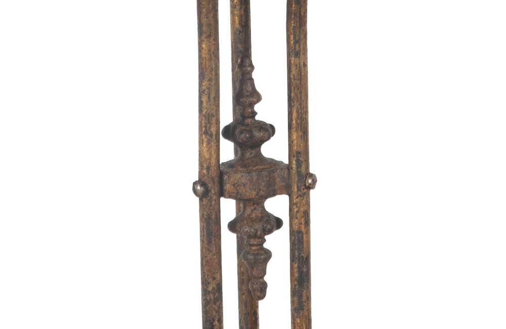 French late 19th century ron gueridon with gilt iron base that bears three decorative finials, to the top, middle and base of the tripod support.