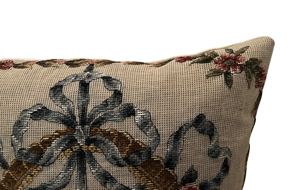 20th Century French Neo-Classical Revival cushion featuring a classic floral basket motif with ribbon detailing