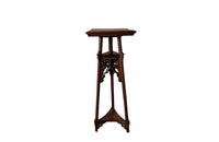 French 19th century walnut sculpture stand with rotating top and a lower shelf, carved in the Neo-Gothic style