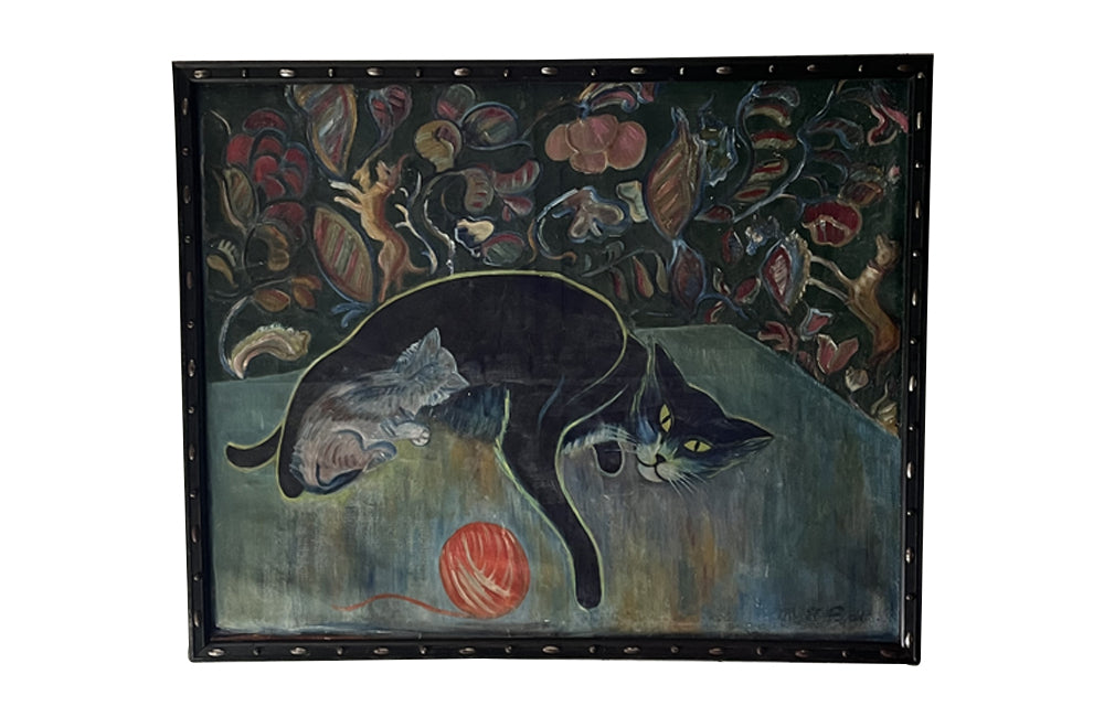 Large 20th Century framed oil on canvas painting of a reclining black cat with her kitten and a ball of wool on a table. 