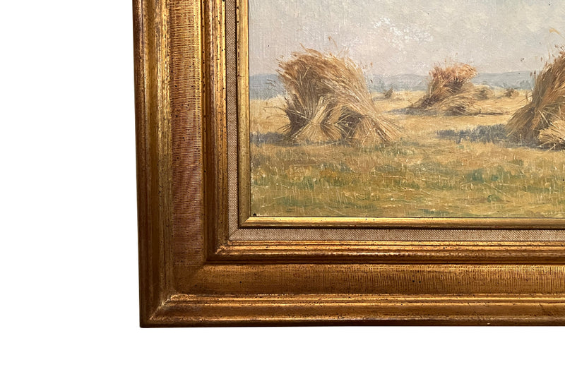 19th century framed, oil on canvas landscape painting of a field with haystacks - French Antiques