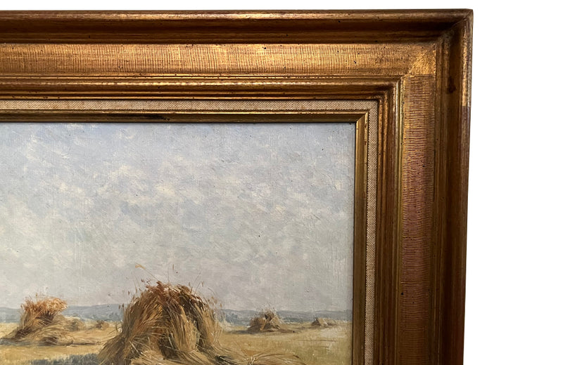 19th century framed, oil on canvas landscape painting of a field with haystacks - French Antiques