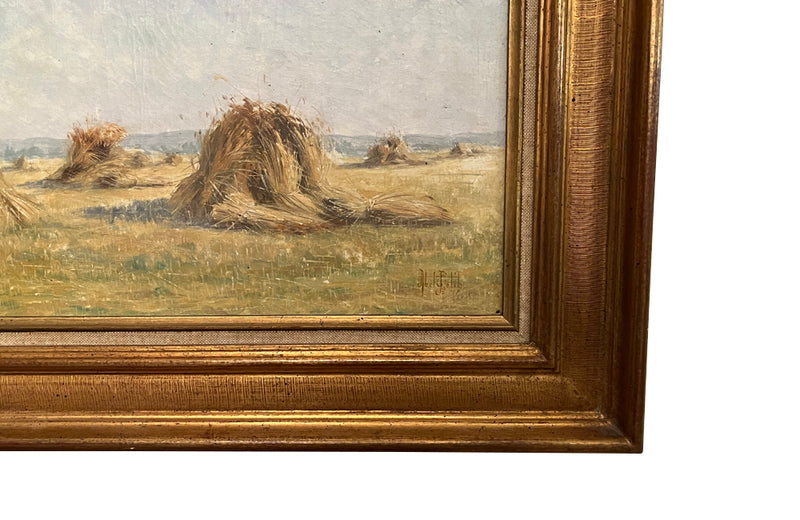 19th century framed, oil on canvas landscape painting of a field with haystacks - French Antiques