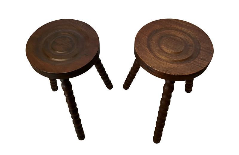 Pair of French vintage tripod stools with bobbin carved legs.