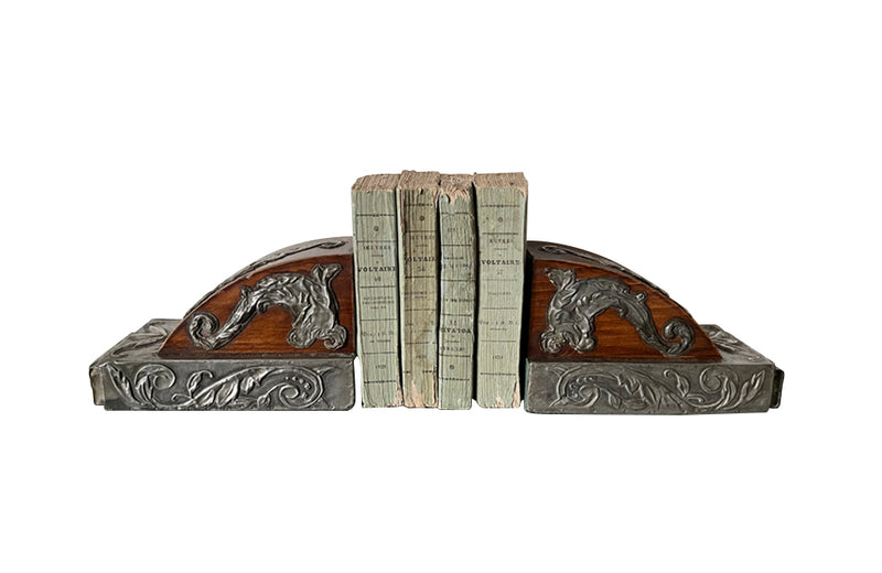 Pair of chinoiserie wood and pressed pewter bookends decorated with dragons, dolphins and foliate motifs circa 1900