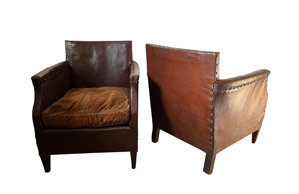 Charming little pair of club chairs with their origianl feather filled cushions circa 1920