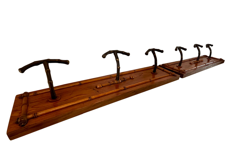 pair of French wooden and iron coat racks with faux bamboo decoration circa 1900