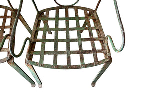 quirky pair of iron garden chairs 