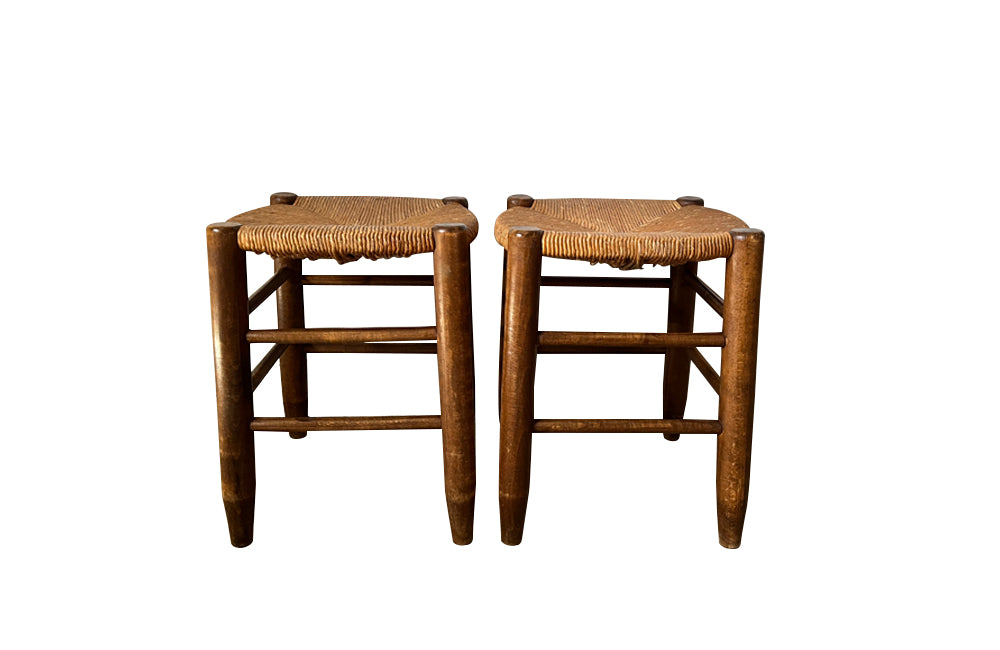 Pair of Charlotte Perriand style strawed seat beech stools