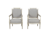 Pair of 19th century, French open 
armchairs in the Neo-Classical style. Reupholstered in linen