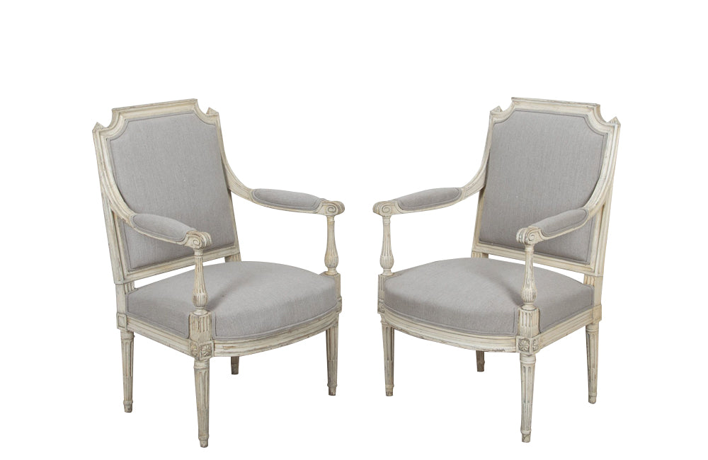 air of 19th century, French open 
armchairs in the Neo-Classical style. Reupholstered in linen