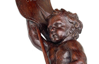 Pair of 19th century French hand carved cherubs bearing pennants inscribed with the names of famous literary figures.