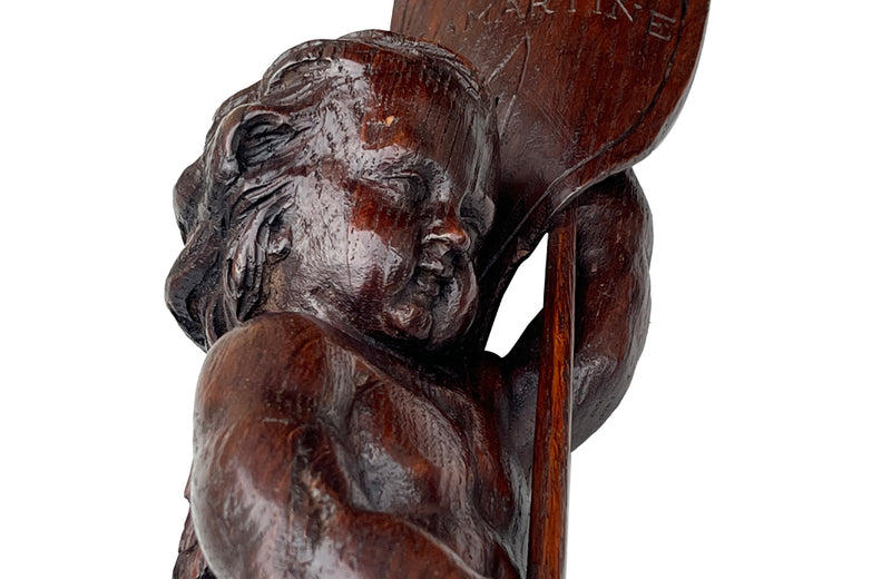 Pair of 19th century French hand carved cherubs bearing pennants inscribed with the names of famous literary figures.