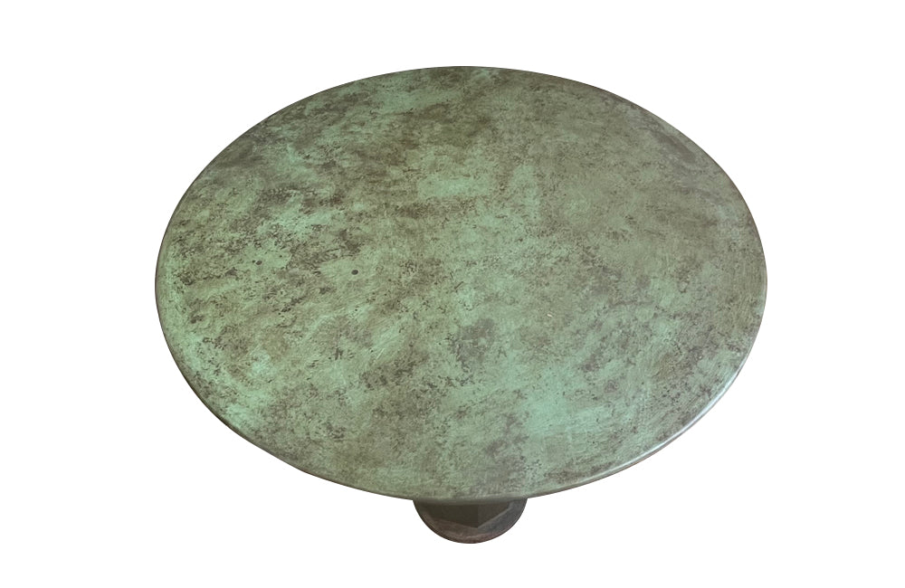 Decorative pair of French cast iron columnar based gueridon tables.