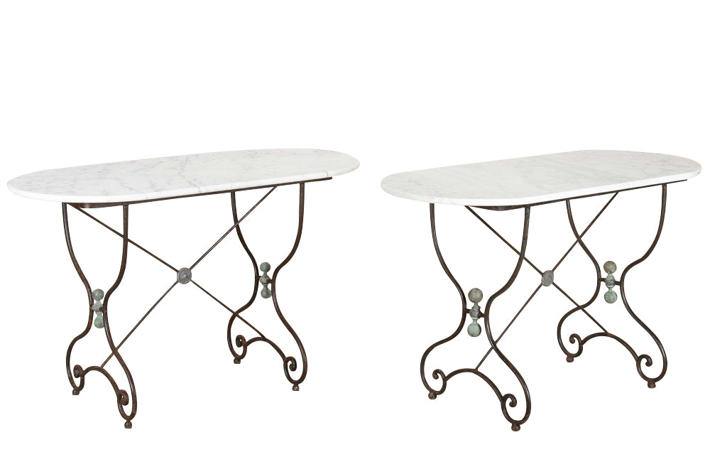 Beautiful, pair of large 19th Century French iron tables with oval marble tops.