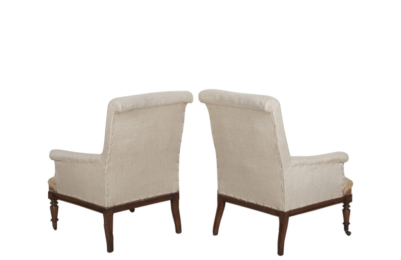 Pair of elegant large late 19th Century French country house armchairs with scrolled backs.