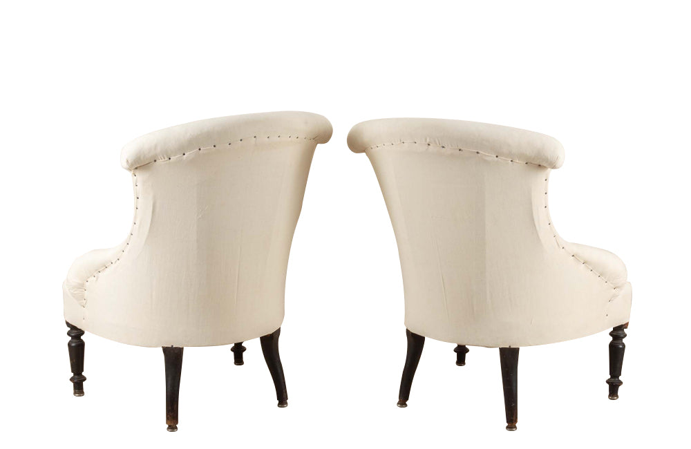 Pair of charming 19th Century French Napoleon III slipper chairs with gently curved scroll backs.