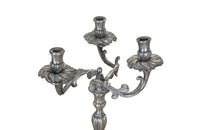 Pair of late 19th Century French worn silver plated candleabras in the Rococo style.