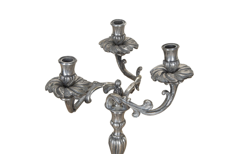 Pair of late 19th Century French worn silver plated candleabras in the Rococo style.