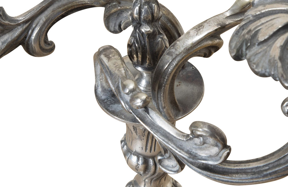 Pair of late 19th Century French worn silver plated candleabras in the Rococo style.