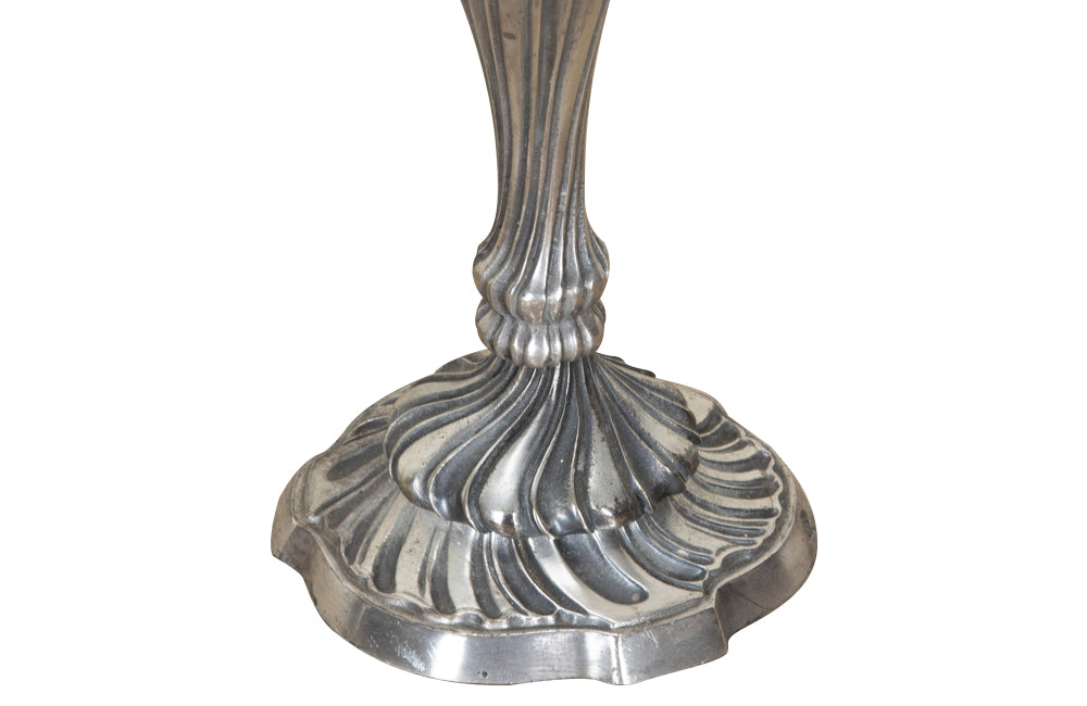 Pair of late 19th Century French worn silver plated candleabras in the Rococo style.