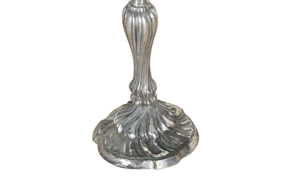 Pair of late 19th Century French worn silver plated candleabras in the Rococo style.