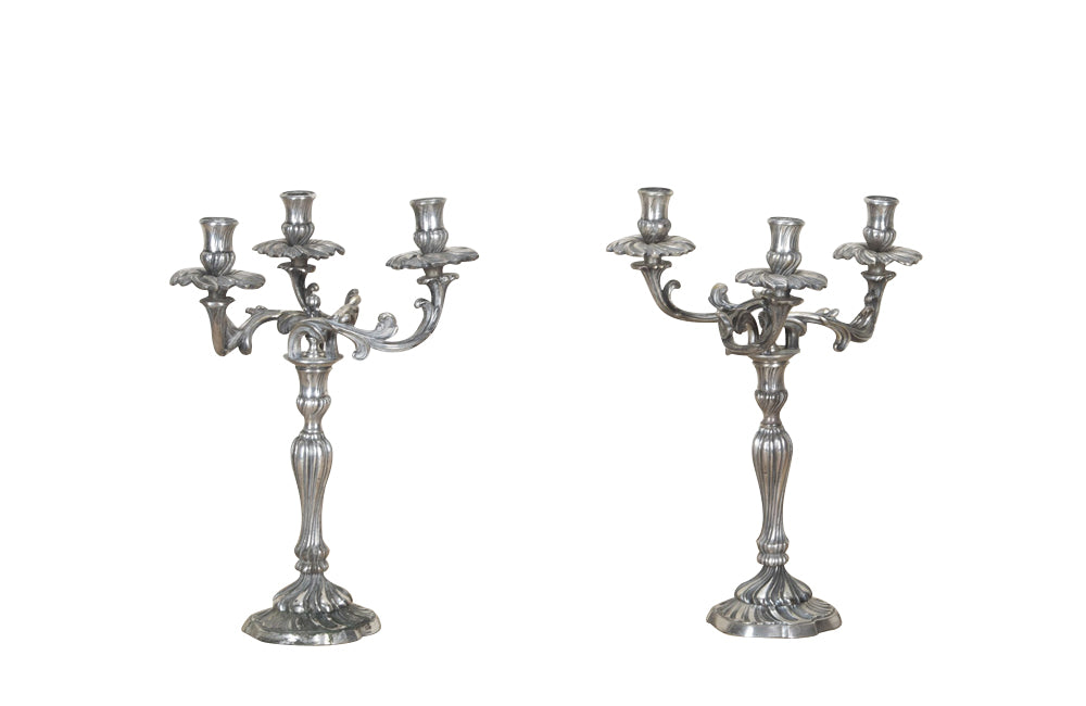 Pair of late 19th Century French worn silver plated candleabras in the Rococo style.