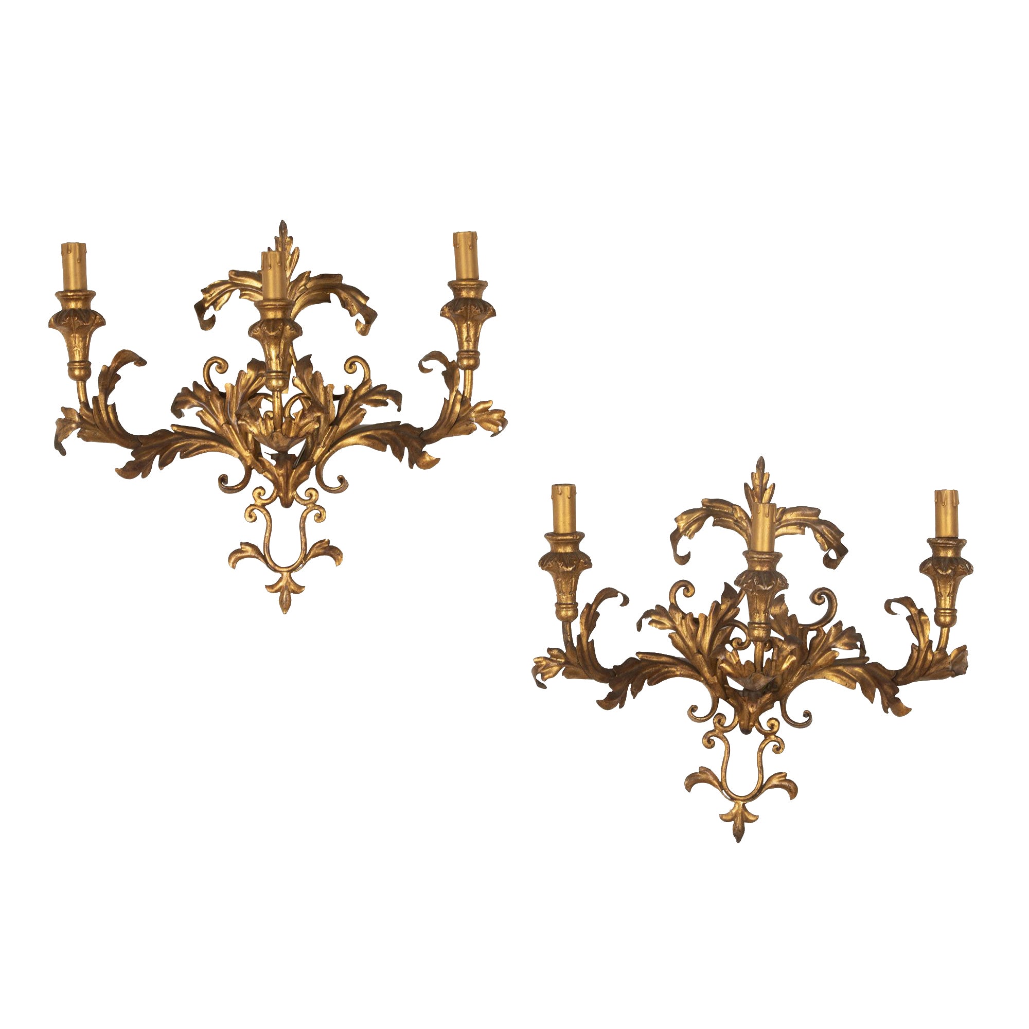 A decorative and elegant pair of 20th Century Italian gilt tole and wood wall lights.
