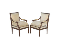 Pair of early 20th Century French Louis XVI Revival open armchairs in the Neo-Classical style.