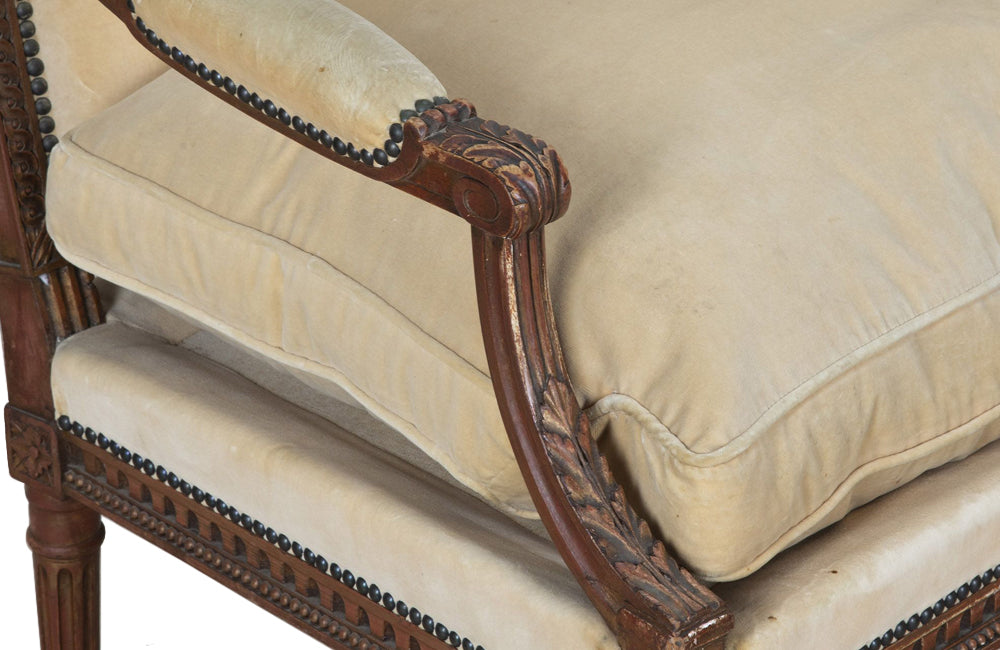 Pair of early 20th Century French Louis XVI Revival open armchairs in the Neo-Classical style.