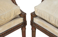 Pair of early 20th Century French Louis XVI Revival open armchairs in the Neo-Classical style.