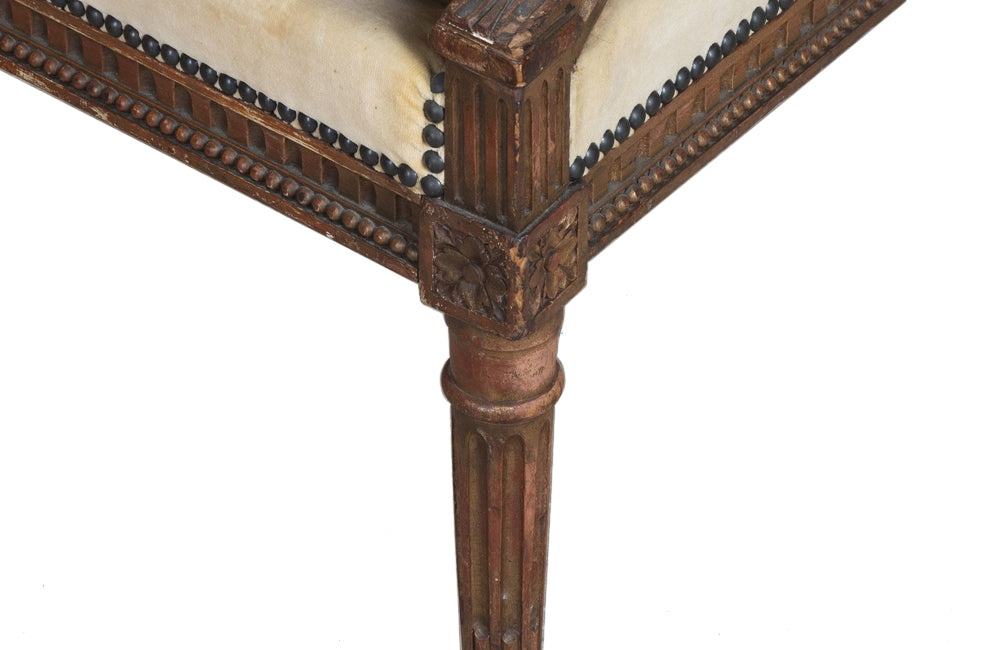 Pair of early 20th Century French Louis XVI Revival open armchairs in the Neo-Classical style.